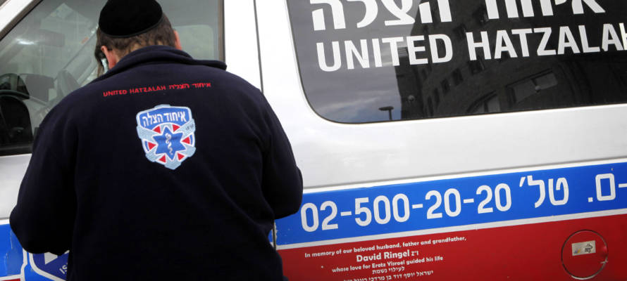 An Orthodox Jewish volunteer of the Emergency Medical Service organization, United Hatzalah, seen near an ambulance in Jerusalem.