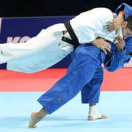 Luka Maisuradze of Georgia, top, competes against Saeid Mollaei of Iran during a men's -81 kilogram bronze medal match of the World Judo Championships in Tokyo, Wednesday, Aug. 28, 2019.