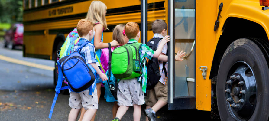children board school bus