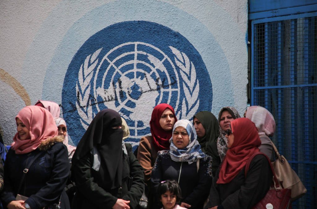 UNRWA staff members outside the UNRWA offices in Gaza City on April 14, 2019.