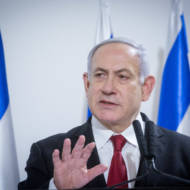 Prime Minister Benjamin Netanyahu delivers a statement to the press after a security cabinet meeting following the escalation of violence with the Gaza Strip, at the defense headquarters in Tel Aviv, on November 12, 2019.