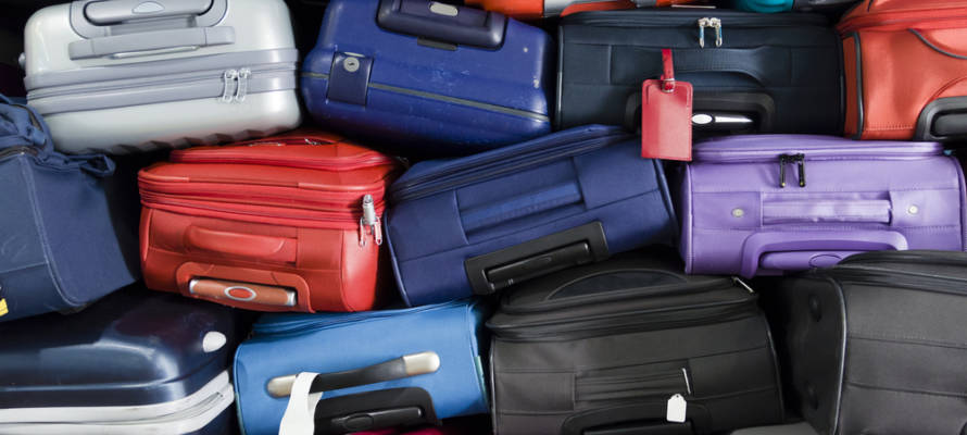 Piled airport luggage (Shutterstock)