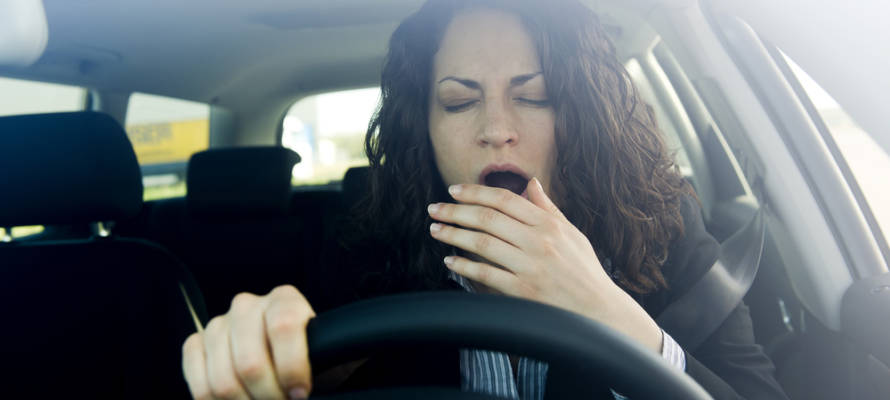 Woman falling asleep while driving (Shutterstock)