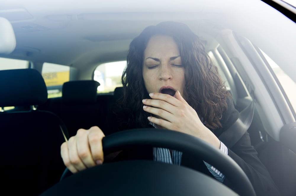 Woman falling asleep while driving (Shutterstock)