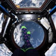 Chanukah socks on the feet of astronaut Jessica Meir, in outer space