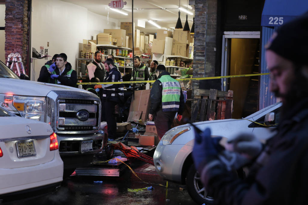 Emergency responders work at a kosher supermarket, the site of a shooting in Jersey City, N.J., Wednesday, Dec. 11, 2019.