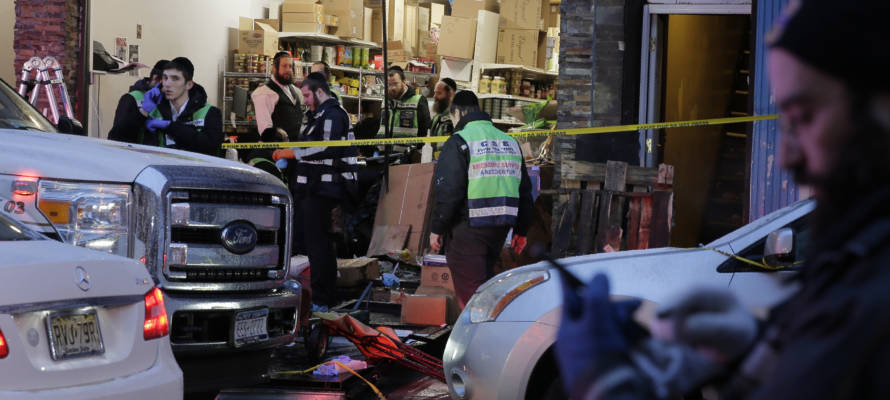 Emergency responders work at a kosher supermarket, the site of a shooting in Jersey City, N.J., Wednesday, Dec. 11, 2019.