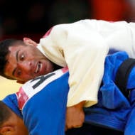 In this Thursday, Aug. 30, 2018 file photo, Saeid Mollaei of Iran, top, competes against Didar Khamza of Kazakhstan during their men's - 81kg final judo match at the18th Asian Games in Jakarta, Indonesia.