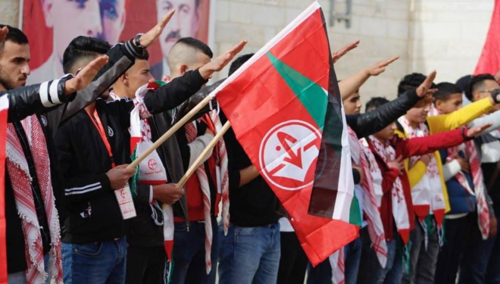 Palestinians celebrate anniversary of the establishment of terror roup Popular Front for the Liberation of Palestine with Nazi salute, Ramallah (Quds News/Facebook)