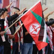 Palestinians celebrate anniversary of the establishment of terror roup Popular Front for the Liberation of Palestine with Nazi salute, Ramallah (Quds News/Facebook)