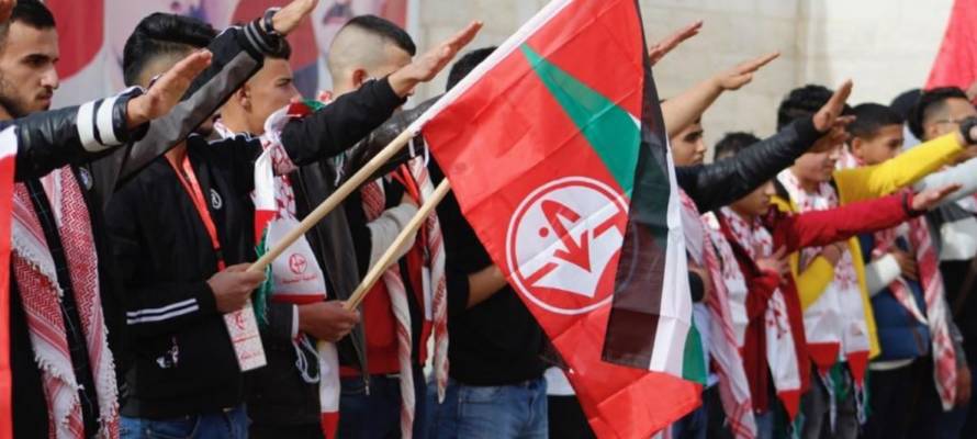 Palestinians celebrate anniversary of the establishment of terror roup Popular Front for the Liberation of Palestine with Nazi salute, Ramallah (Quds News/Facebook)