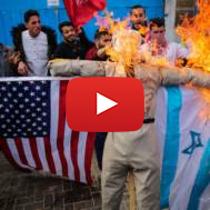 Palestinians burn an effigy of Donald Trump