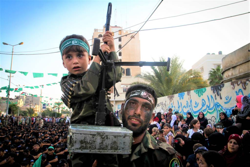 A Palestinian child holding a machine gun at a Hamas rally in the Gaza Strip