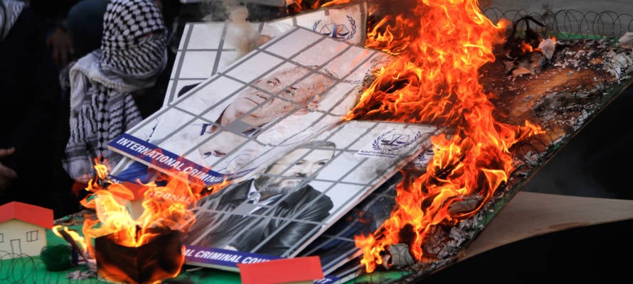 Fatah supporters burn a model of an Israeli Jewish community and images of Israeli political leaders during a rally to celebrate the 55th anniversary of the founding of the Fatah movement, in Shechem (Nablus), on January 6, 2020.