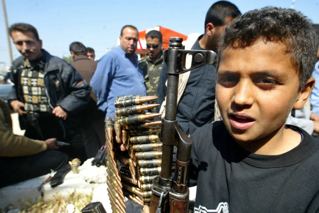 Palestinian child with weapons and ammunition