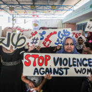 Palestinian women participate in the protest against violence against women