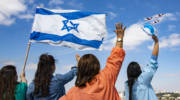 Israeli medical staff cheer an Israeli Air Force acrobatic team.