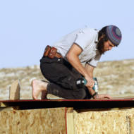 An Israeli builds a new dwelling