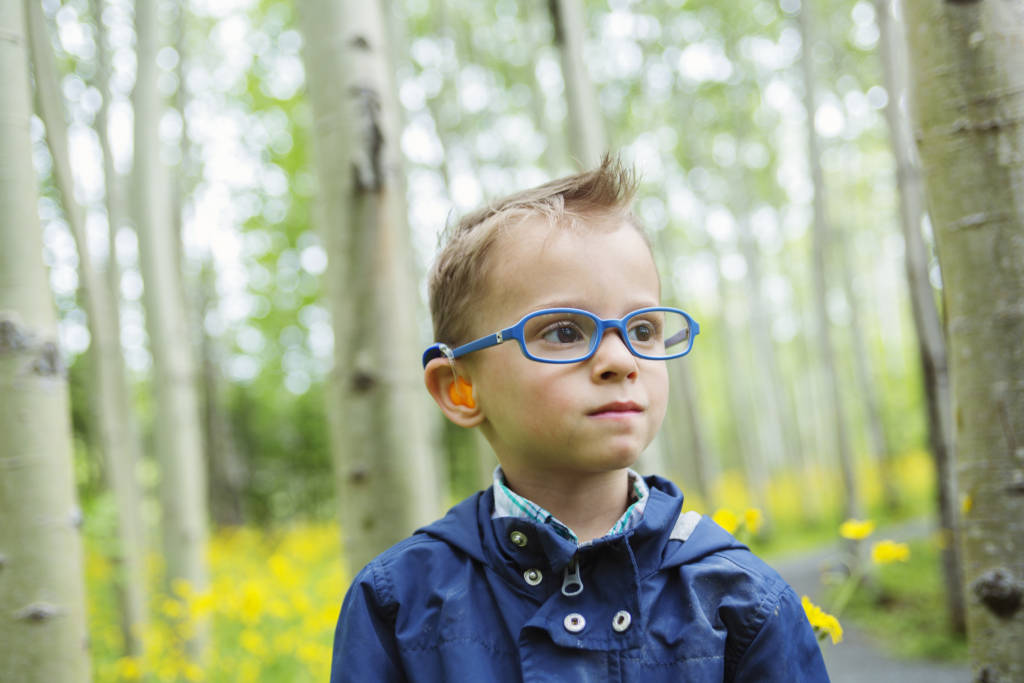 Boy with a hearing aid