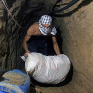 Palestinians smuggle goods and food through tunnels from Egypt