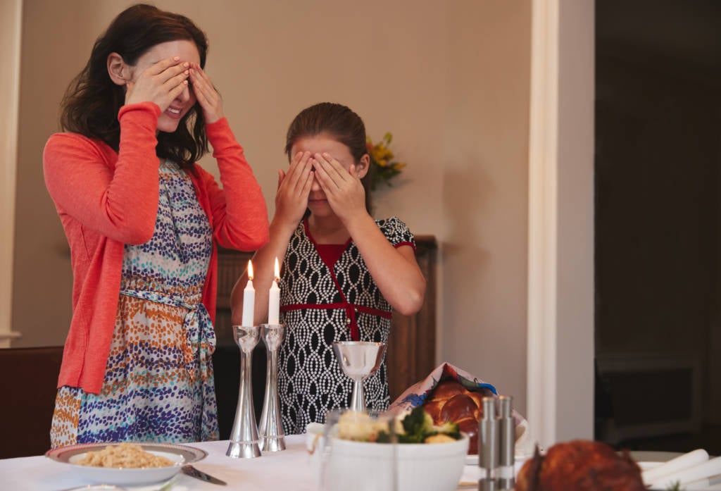 lighting Shabbat candles