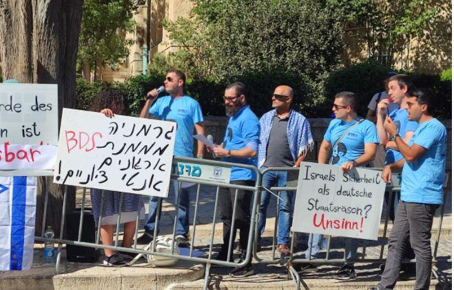 Im Tirtzu demonstration Angela Merkel