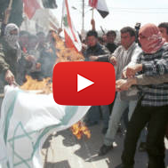 Palestinians burn the Israeli flag