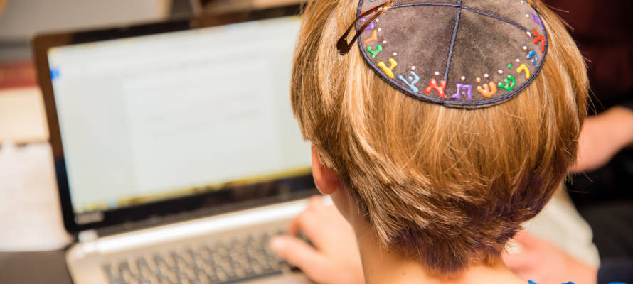 Jewish boy with computer