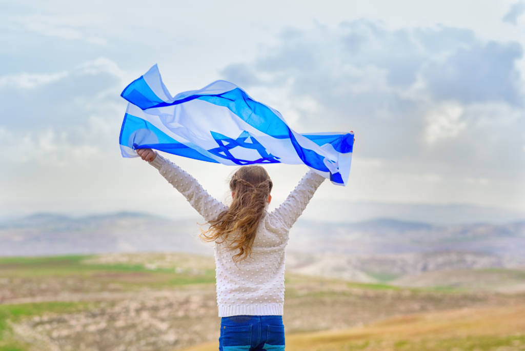 Little,Patriot,Jewish,Girl,Standing,And,Enjoying,With,The,Flag