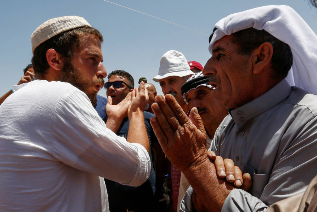 Palestinian argues with an Israeli