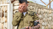 Israeli soldier puts on tefillin