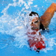 Athletic lifeguard in rescue swimming