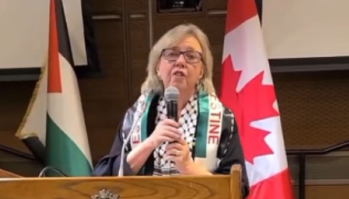 Elizabeth May at an event that hosted known antisemite and Holocaust denier Nazih Khatatba. (