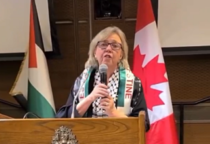 Elizabeth May at an event that hosted known antisemite and Holocaust denier Nazih Khatatba. (
