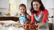 Jewish mother and daughter back challah