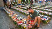 .Israeli soldiers and volunteers pack food for families in need