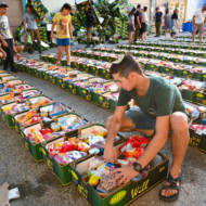 .Israeli soldiers and volunteers pack food for families in need