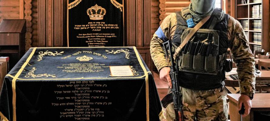 Ukrainian security forces inside the synagogue at the Anatevka