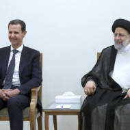 Syrian President Bashar Assad, left, and Iran's Ebrahim Raisi in Tehran