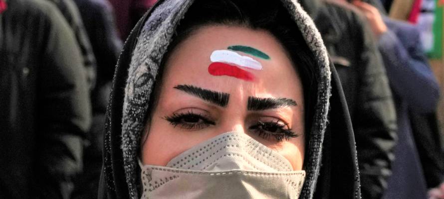 A woman celebrates Iran's 1979 Islamic Revolution in Tehran, Iran, Saturday, Feb. 11, 2023