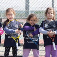 Players from the Israel Tennis & Education Centers wear coexistence-themed shirts