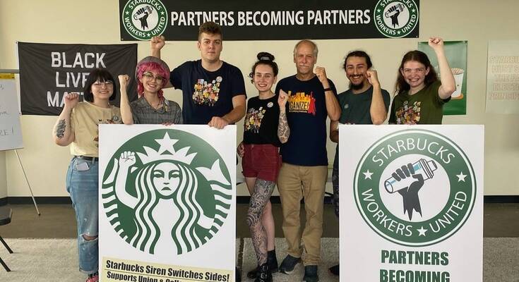 Jaz Brisack (R) and fellow Starbucks employees August 31, 2021.