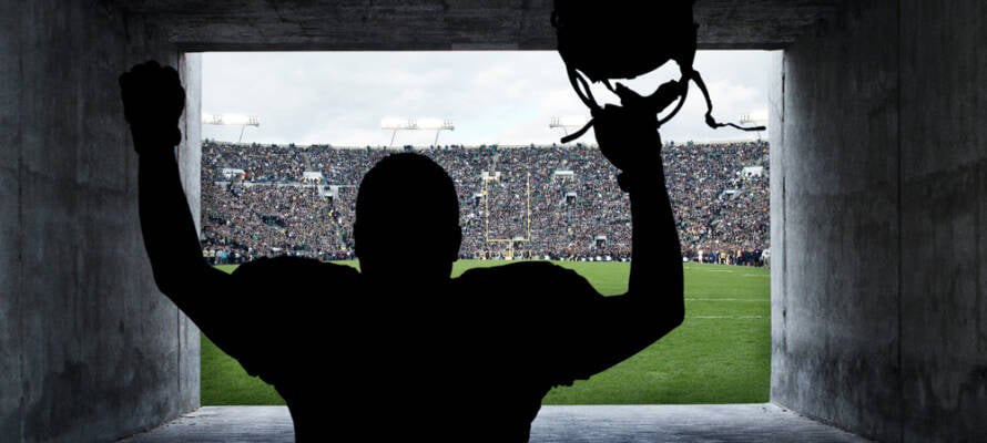 Football Player running out of the Stadium Tunnel