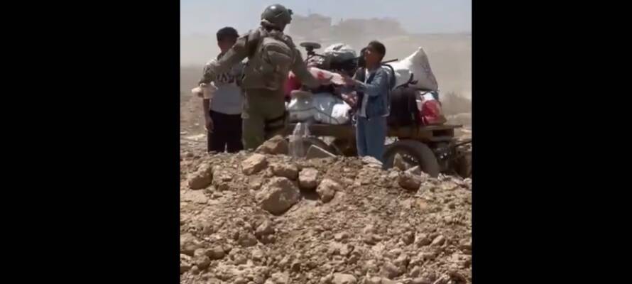 soldier giving water