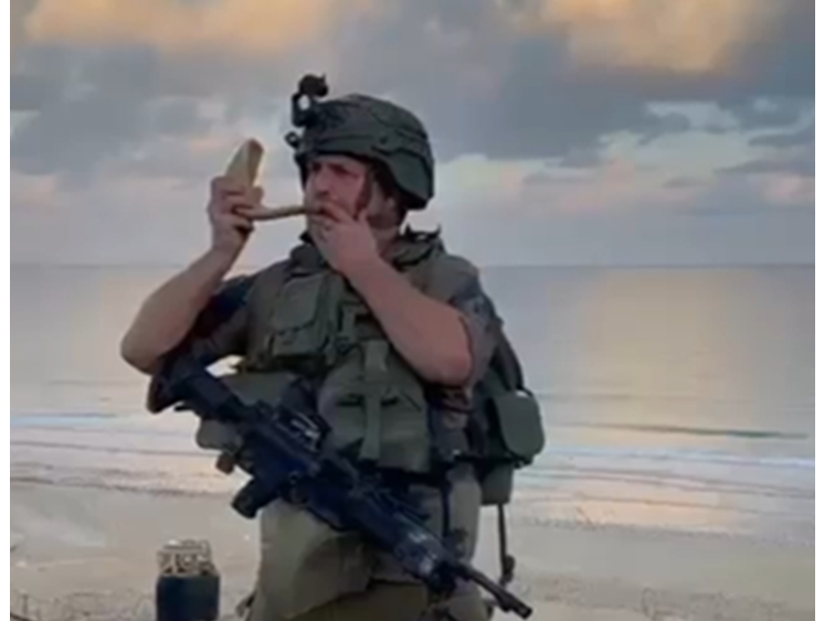 soldier blows shofar