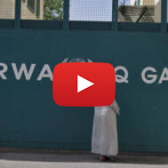 A man waits outside UNRWA headquarters in Gaza City. (FLASH90/Wissam Nassar)