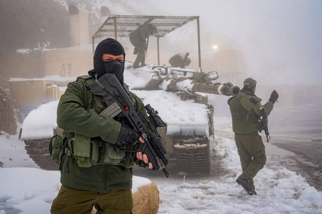 Israeli soldiers patrol on Mount Hermon