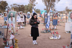 Girl prays at Nova Festival site