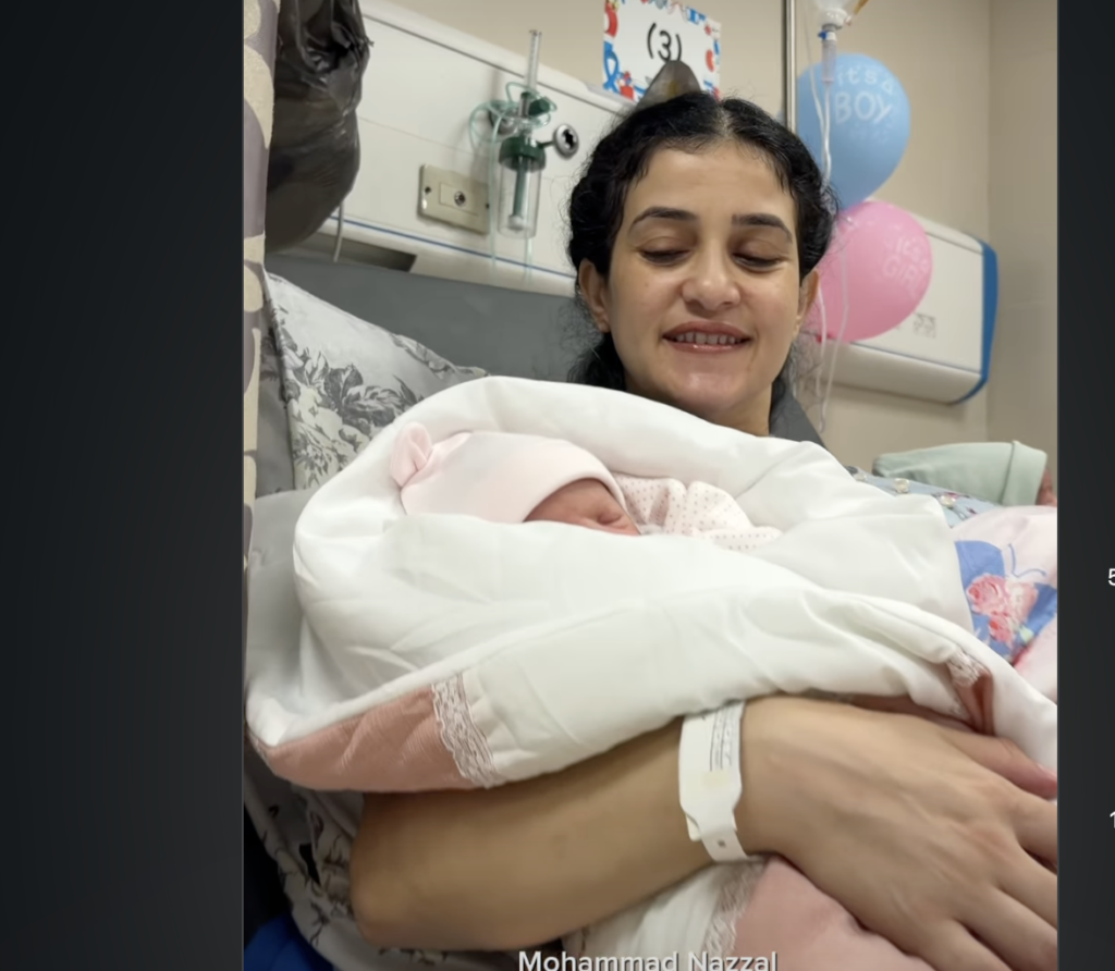 Sanabel Al-Rai, wife of convicted terrorist Basel Al-Asmar, poses with twins.