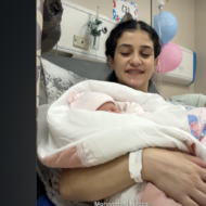 Sanabel Al-Rai, wife of convicted terrorist Basel Al-Asmar, poses with twins.